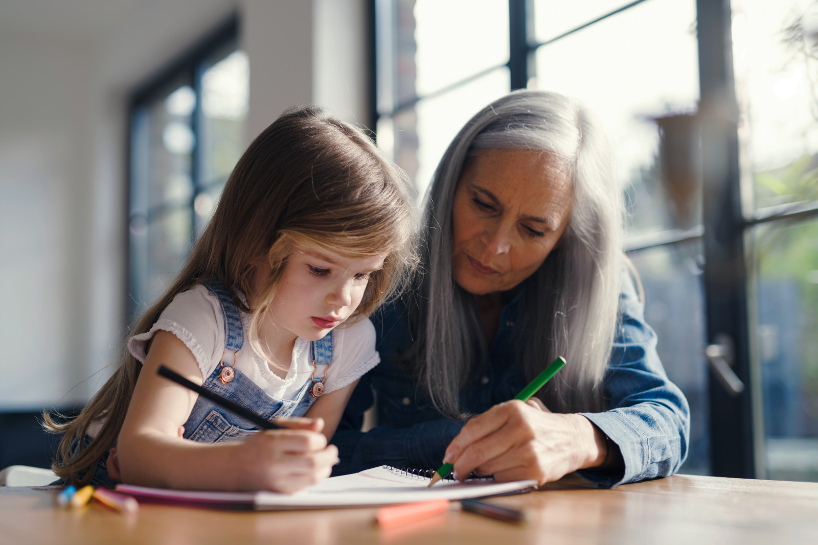 Grandmother and Granddaughter Making a Drawing Together