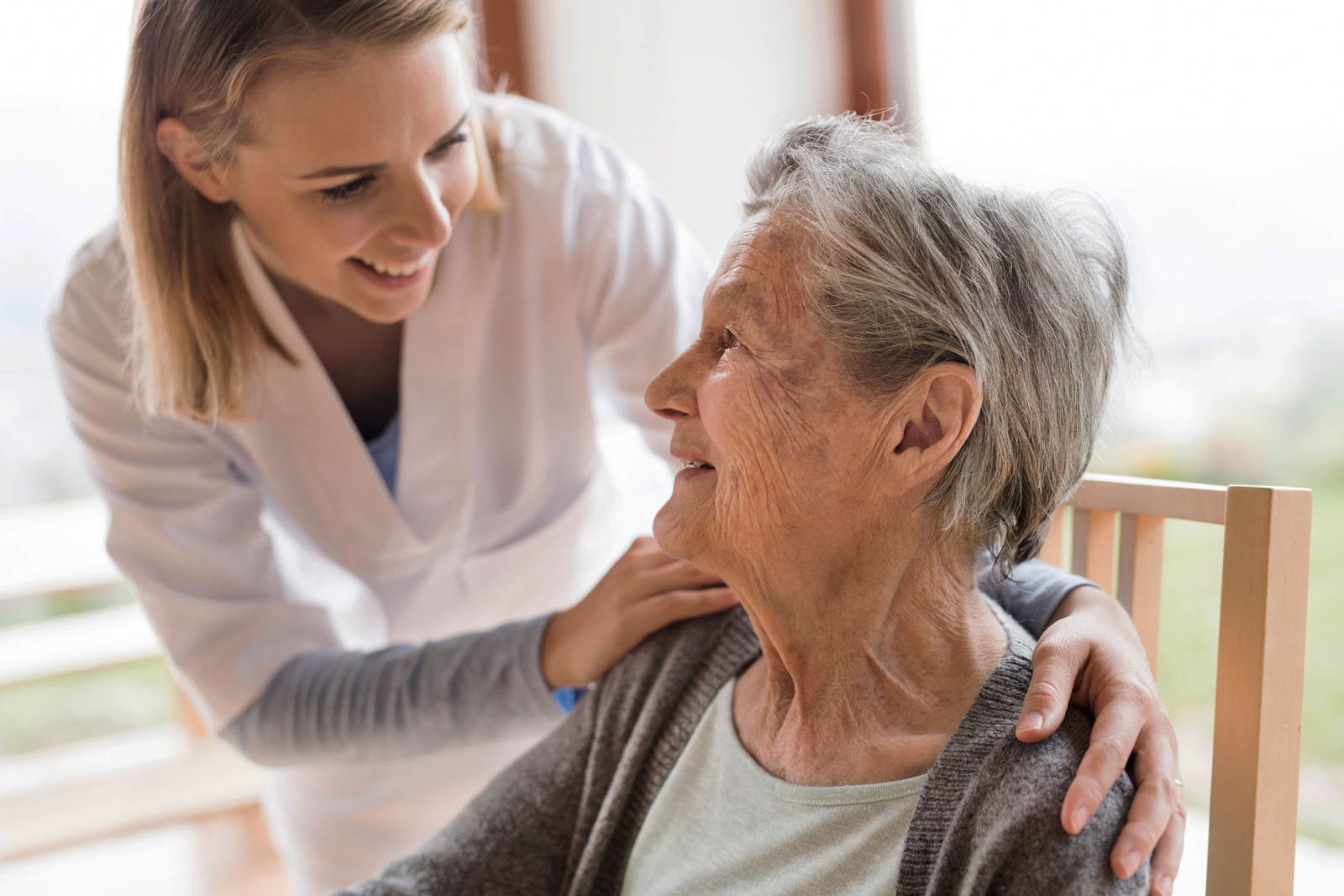 Older Woman Being Visited by Healthcare Practictioner