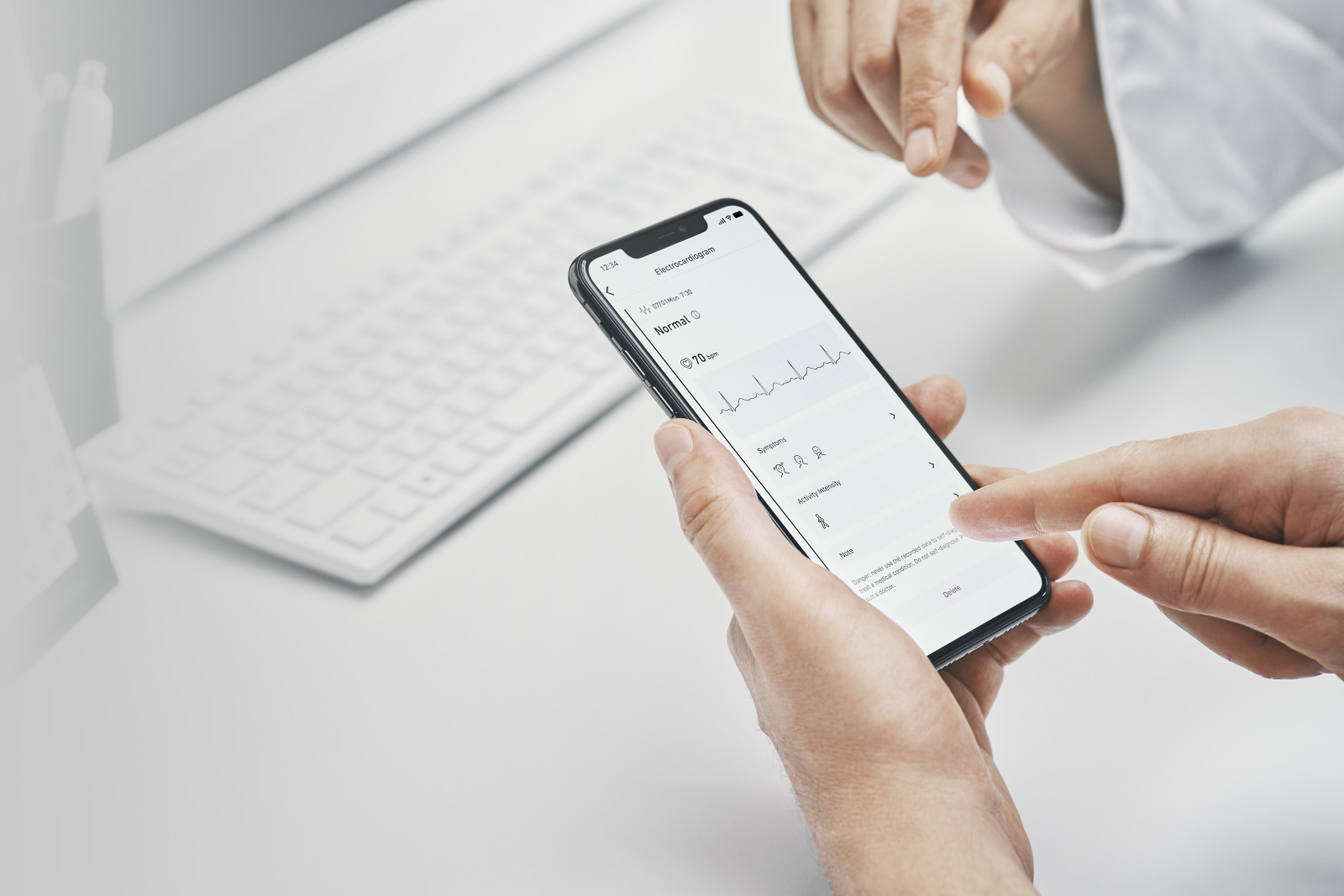 OMRON connect app | Doctor reviewing data with patient