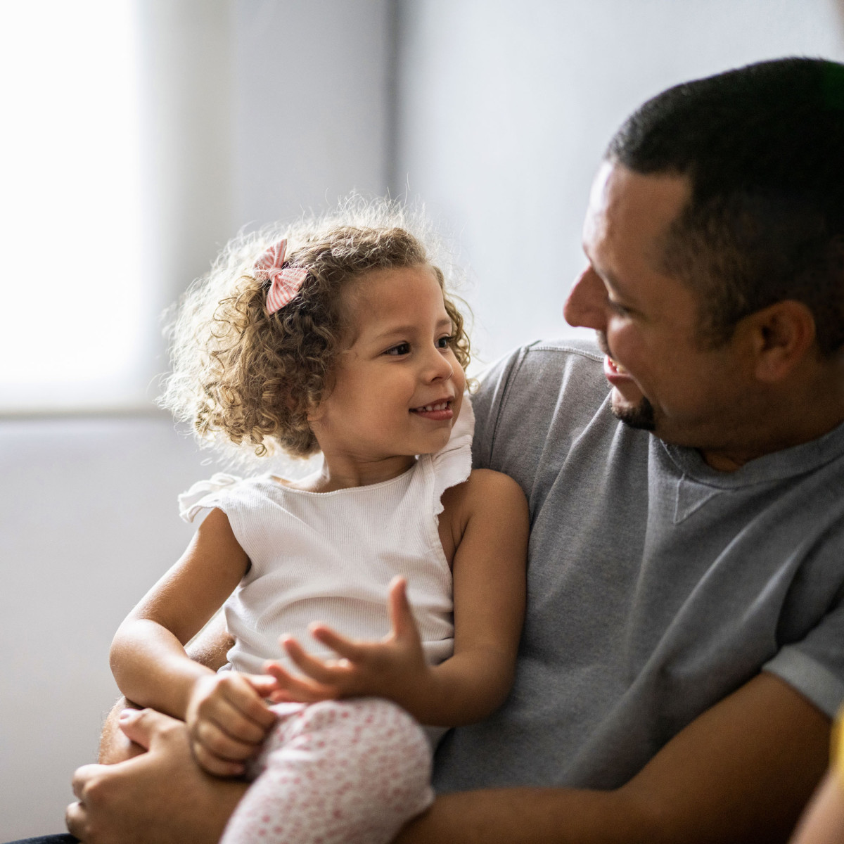 Father and daughter smiling