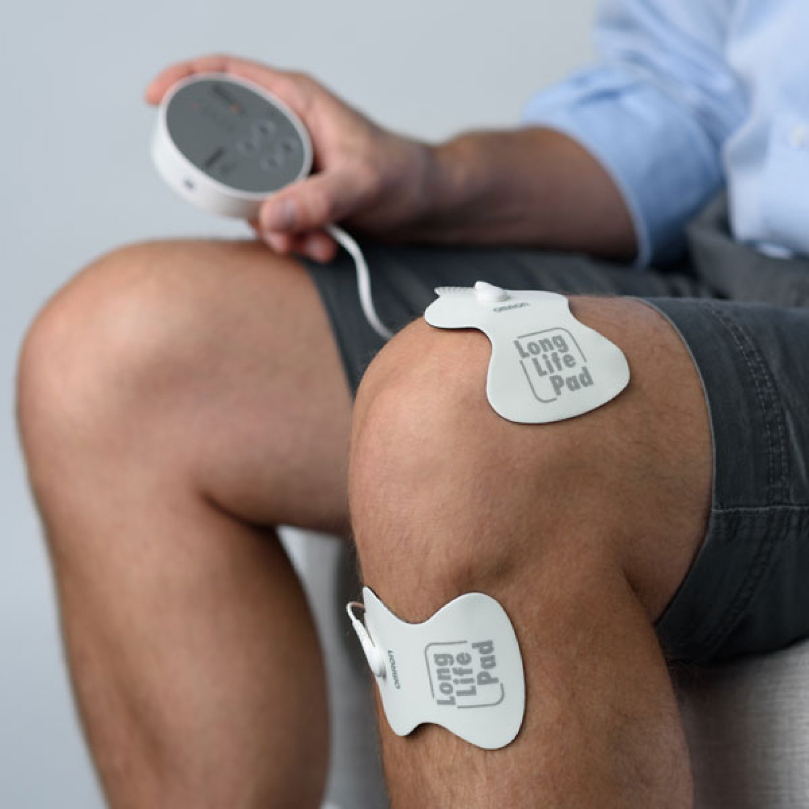 Man using TENS device