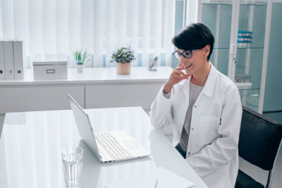 Doctor looking at computer